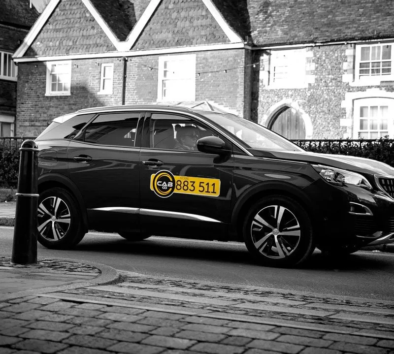 CabCo taxi with the Folkestone number 883 511 on its door